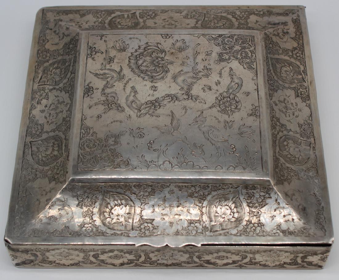 SILVER. Persian .875 Silver Dresser Box.: Beautiful Persian .875 silver hinged dresser box with chamfered lid. Decorated throughout with flowers and birds. Stamped to underside with Iranian silver mark representing .875 silver; with additiona