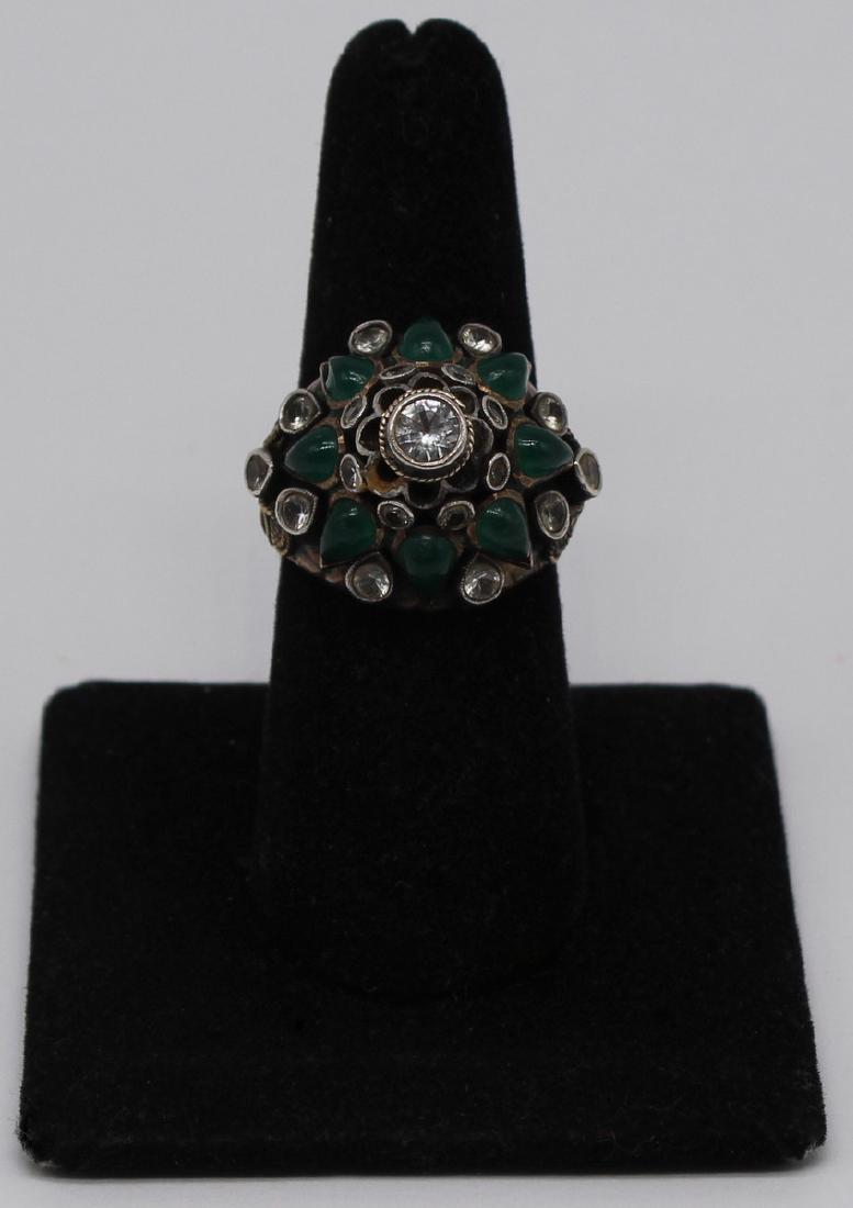JEWELRY. Mughal 14kt Gold Diamond and Emerald: Ring. Mughal Princess 14kt yellow gold ring set with (8) emerald cabochons, (18) round diamond accents, and terminating a diamond measuring approx. 4mm or 0.25cts. Stamped to interior of shank, "