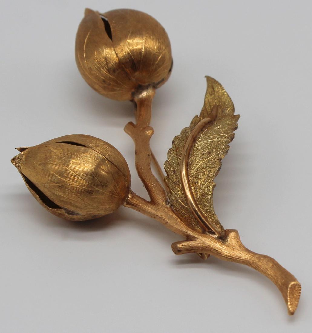 JEWELRY. Buccellati STYLE 18kt Gold Brooch.: Buccellati style floral form brooch with Florentine finish and bi-color goldwork. Total approx. weight is 13 dwt. From a New Rochelle, NY estate. Dimensions: 1.875" w x 3.675" h,
