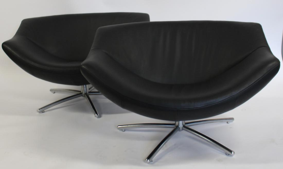 MIDCENTURTY Style Pair Of Leather Upholstered: Lemon Chairs. From a White Plains estate. - Dimensions: 42" x 31"D x 26"H