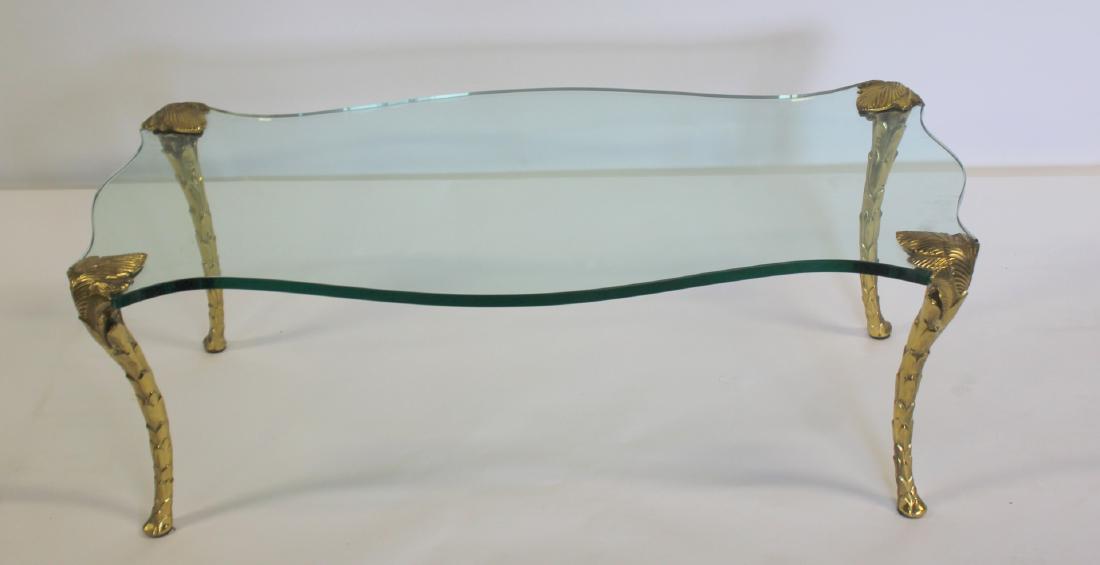 BAGUES Style Glass Coffee Table With Gilt Bronze: Feet . From a Long Island estate . - Dimensions: 47"x23"x 16.5"H