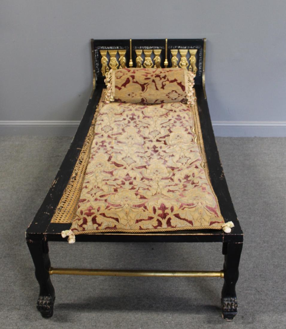 Regency Style Ebonised Caned With Carved Gilt: Decoration Day Bed. Good age and very decorative. Includes throw and pillow in image. From a White Plains estate . - Dimensions: 74" x 33"W x 32"H