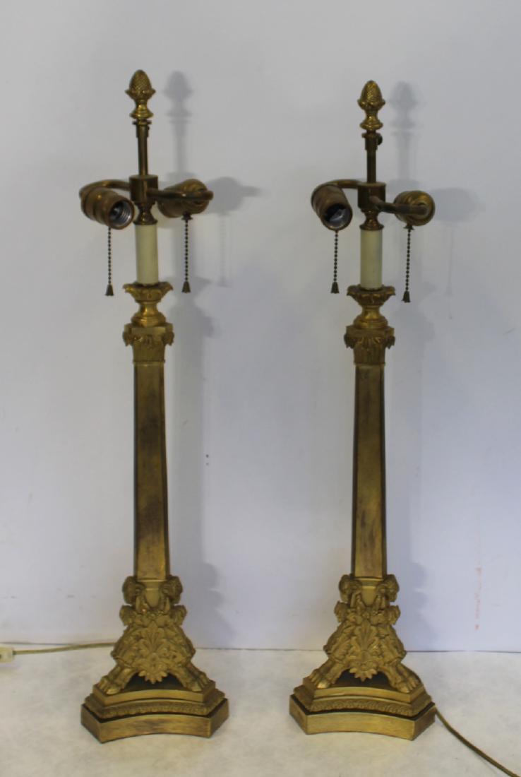 Pair of Antique Gilt Bronze Column Form Table: Lamps on Hoof Feet. Accompanied by a copy of a Sotheby's April 23rd, 1986 appraisal stating, "Pair of French Empire Style Ormolu Candlesticks Circa 1860-80 Each of obelisk form, with a triangular base