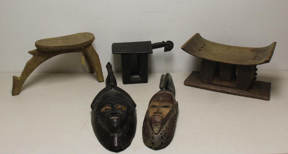 Grouping of African Carved Antiques.: To include a Lobi seat 19" x 10", 2 masks 21" & 24", a stool 17" x 9" x 9" and a horse 13" x 8". From a Long Island estate.