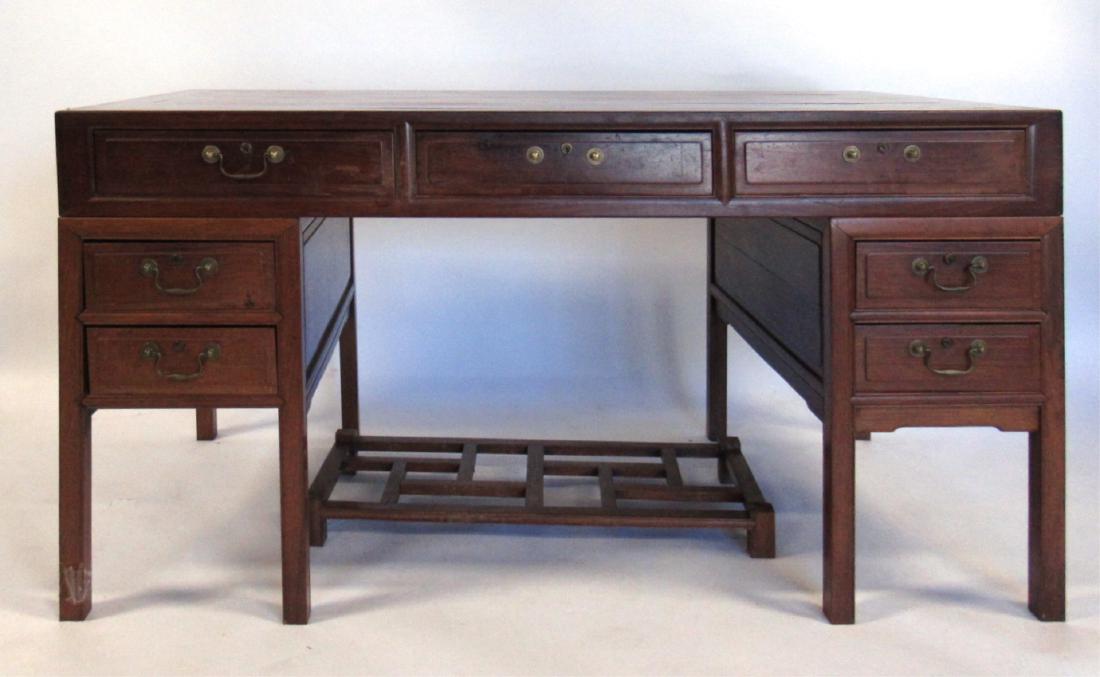 Hongmu Partner's Desk and Foot Rest.: Chinese, c. 1950. Custom made for Henry Lieberman when he was sent to Hong Kong to open the New York Times Bureau there. Three piece construction with brass hardware. From the estate of Kathryn and He