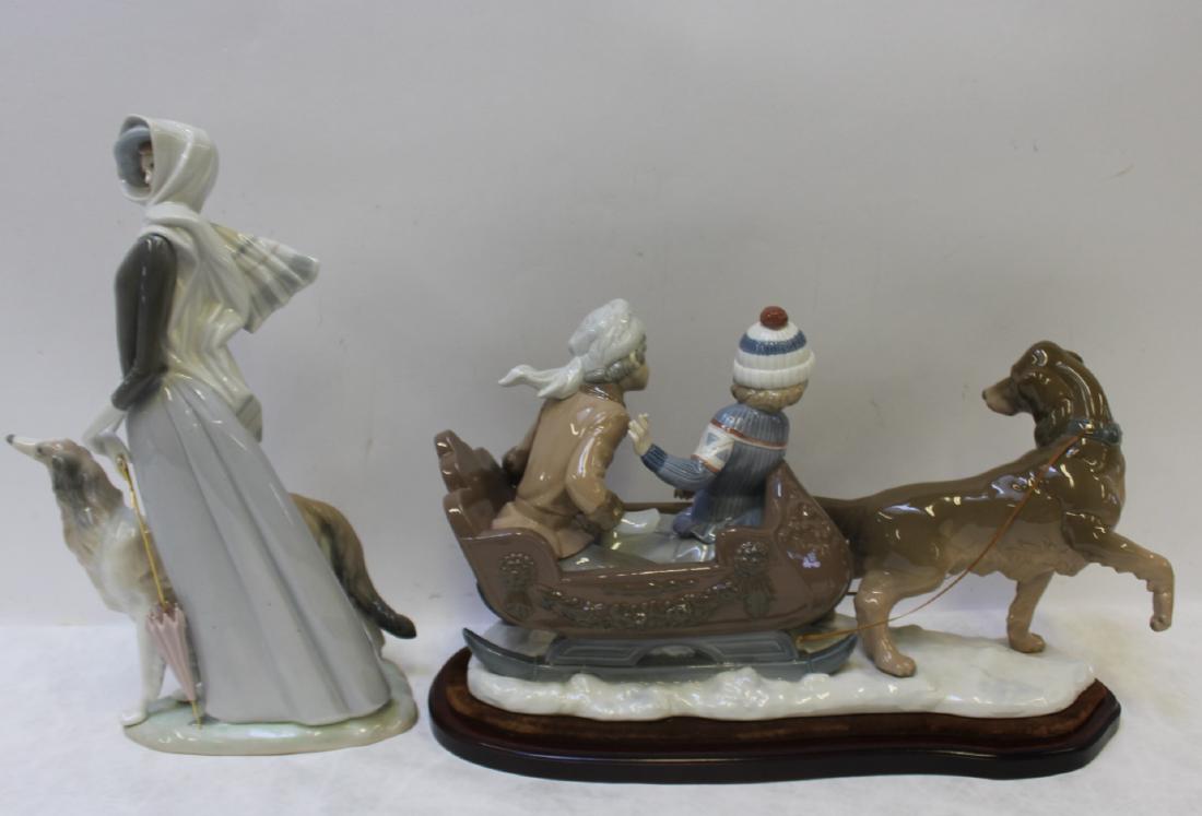 LLADRO. Lot of 2 Porcelain Groupings With: Dogs. Dog Sled with Children (19" x 5.5"D x 11.25"H) and Women with Collie (10.25"W x 5"D x 15.75"H). From an Upper East Side NYC collector.