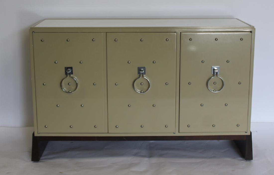 TOMMY PARZINGER. Parzinger Originals: 3 Door Credenza. 3 door lacquered cabinet with studs and milk glass insert top. From a Long Island estate. - Dimensions: 52" W x 16"D x 33"H