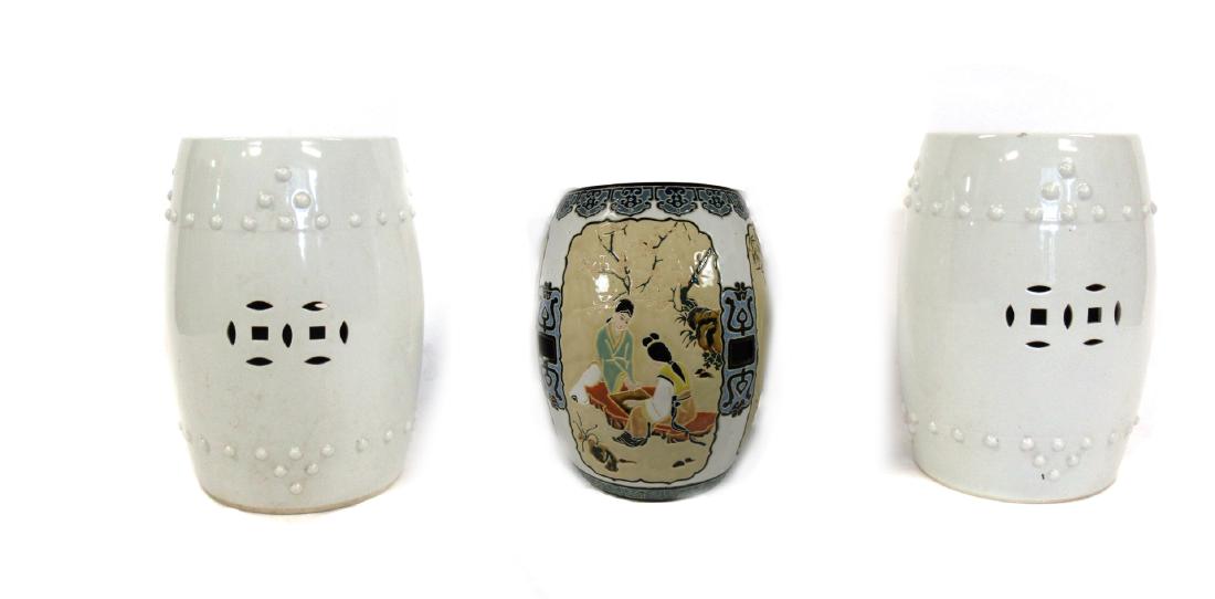 Group of 3 Porcelain Garden Stools.: Chinese, 20th century. With pierced decoration of Chinese coins and bosses surrounding the top and bottom edges. From a Larchmont, NY estate. Dimensions: 19.25" h x 13.5" dia.