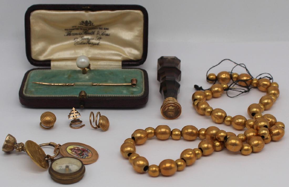 GOLD. Assorted Jewelry and Objets d'Art.: Includes an English East India Company, Madras Presidency, Gold 1/4 Mohur - unfortunately pierced as a pendant; an 18ct gold Ganesha and Mooshika pendant; a compass pendant; a 14kt gold seal fob penda