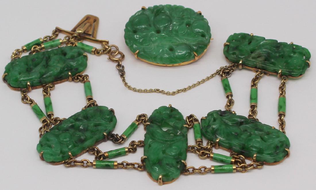JEWELRY. Jade and Gold Jewelry Grouping.: Includes a 14kt yellow gold, carved jade, and enamel decorated bracelet comprised of (5) 14kt gold mounted carved jade pendants depicting flowers separated by three chains with green enamel decorated 