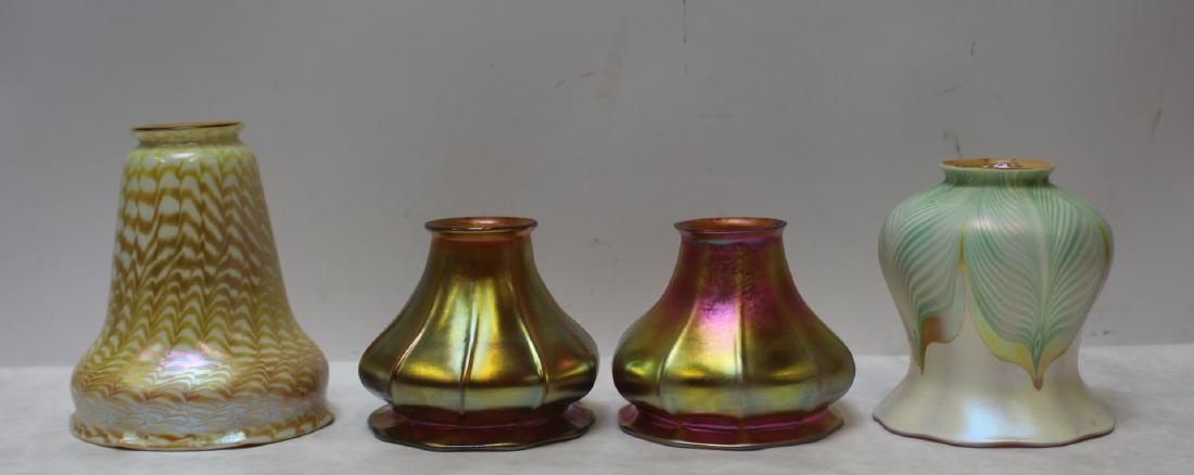 Lot of 4 Antique Art Glass Shades.: To include orange and white Fostoria (5.25" dia x 6.25" h), green and white Quezal (5.25" dia x 6.25" h) and a pair of Steuben Aurene (4.75" dia x 5.5" h). From a Yonkers