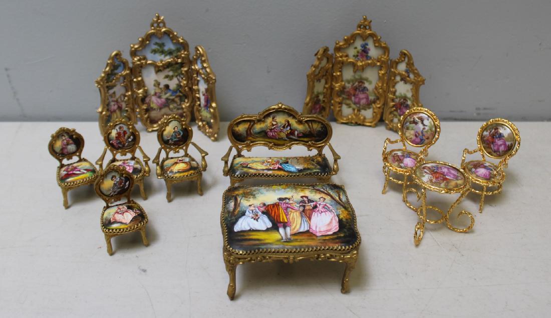 Vintage Grouping of 11 Porcelain Gilt Metal: Mounted Miniatures. To include: 1 music box table (3.5" x 3"), 1 music box screen and 1 screen (5.25" x 5.5" and 5" x 5.5"), chairs (approximately 2.5" h), bench (3&