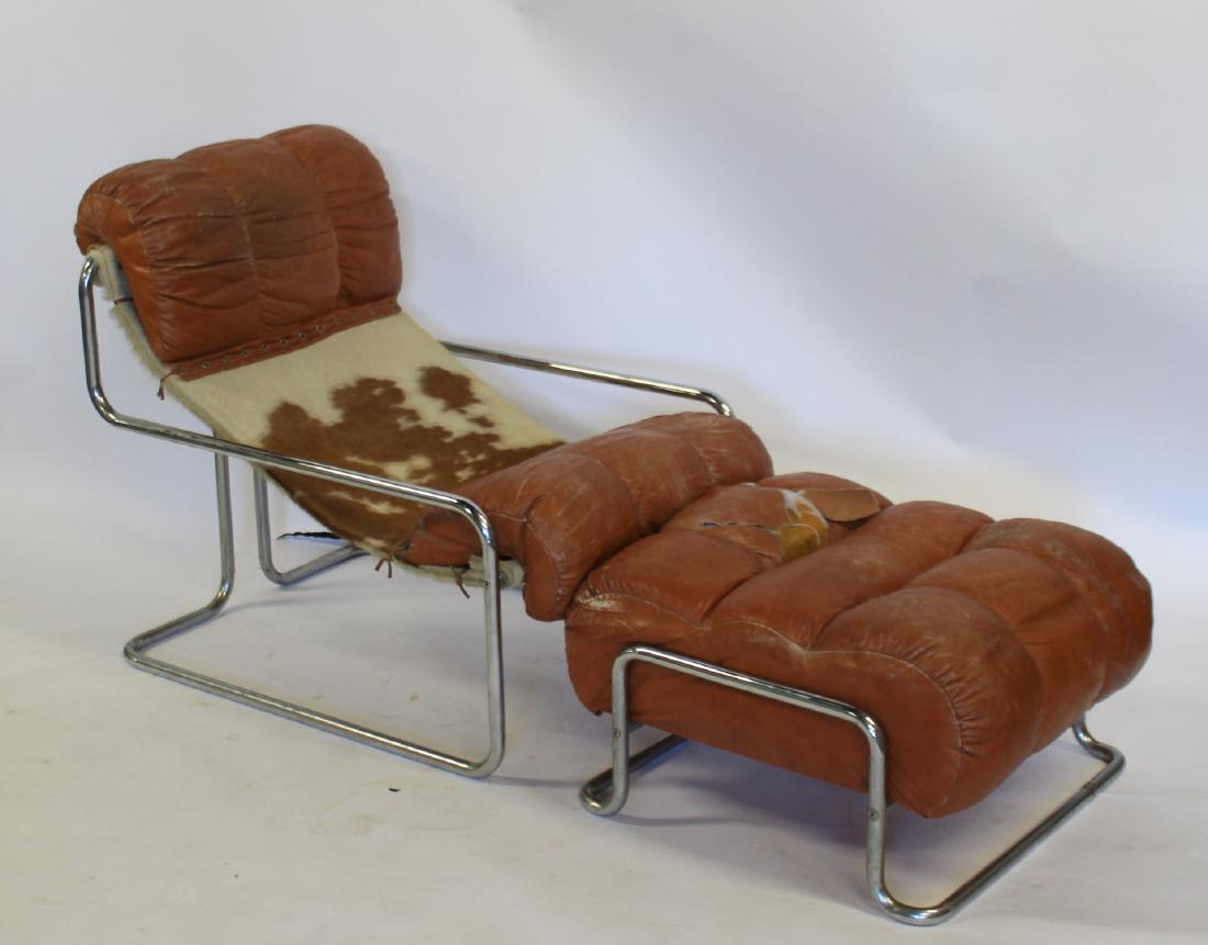 MIDCENTURY. Guido Falschini Hide And Leather: Upholstered Lounge Chair And Ottoman. Dimensions: 43" x 27.5" x 36" H and OTT 29" W x 25.5" x 15.5"H.