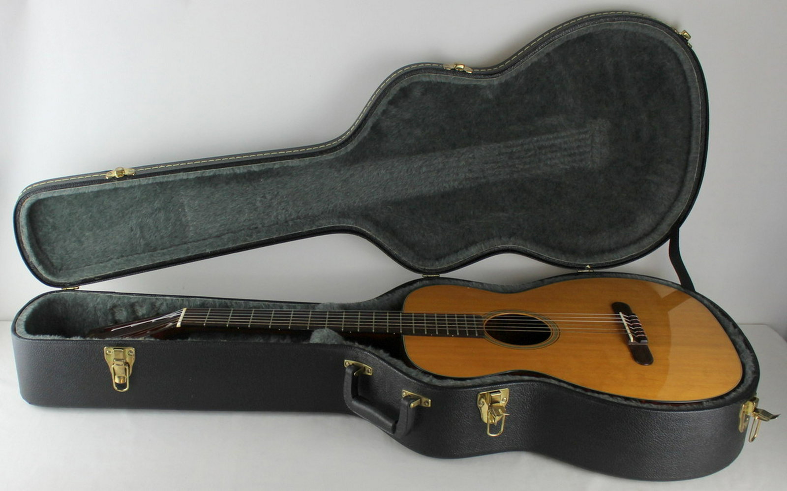 C.F. Martin & Co Guitar, Model No. 00-18G.: C.F. Martin & Co. guitar. Model no. 00-18G, circa 1960. Inscribed to interior, "Made for Gut or Nylon Strings, C.F. Martin & Co Nazareth P.A. Made in U.S.A., 00-18G 179126". With guitar case. From a G
