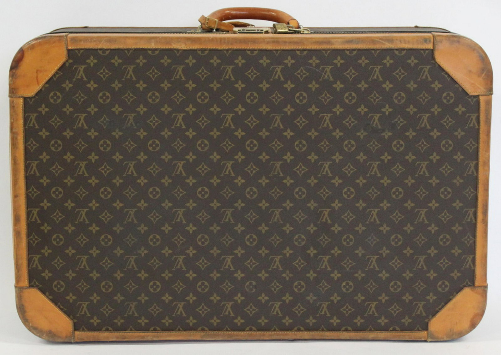 Louis Vuitton Large Vintage Softcase Suitcase.: With interior Louis Vuitton strappings. From a Long Island, NY estate. Dimensions: luggage measures approx. 31.5" w x 10.5" d x 20.5" h, excluding handle.