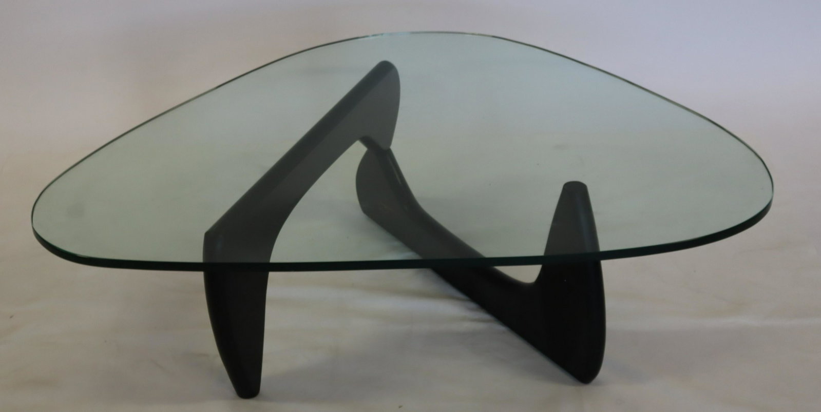 MIDCENTURY. Ebonised Noguchi Coffee Table .: From a Mt Kisco estate. - Dimensions: 49" x 35.5" x 16" h
