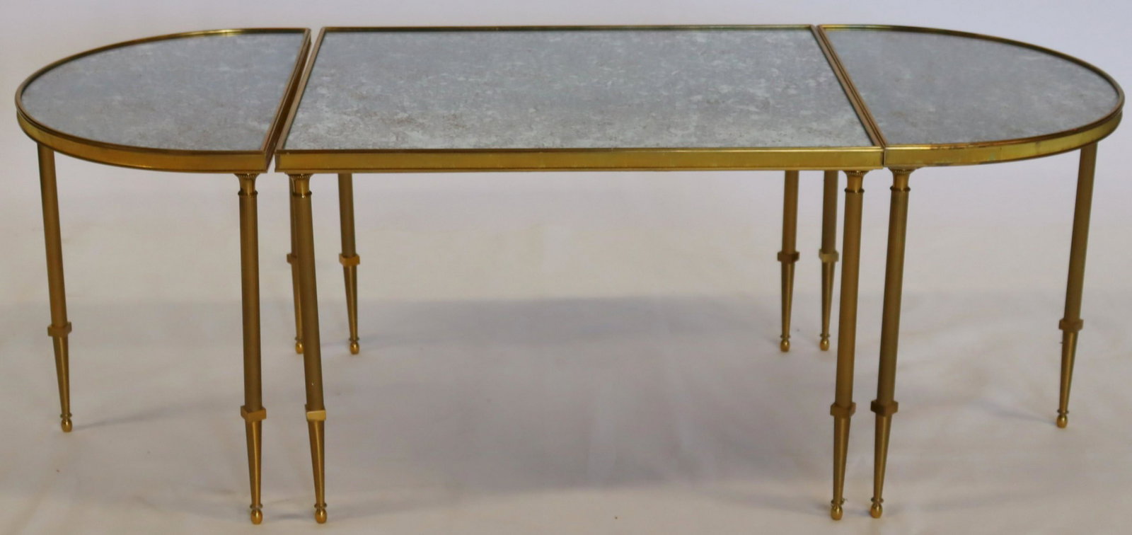 Antique Tri-Part Gilt Mirrored Coffee Table.: Gilt metal and mirrored top with confetti gold in mirror. From a Westchester Estate. - Dimensions: 47.5"w x 20"d x 16.5"h