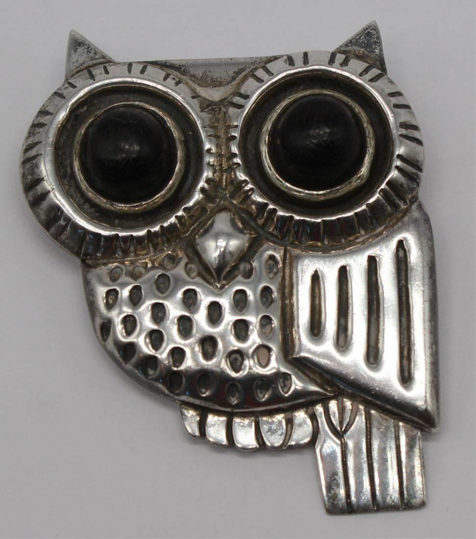 JEWELRY. William Spratling Sterling Owl Brooch.: William Spratling sterling owl form brooch with circular ebonized wood eyes. William Spratling maker's mark circa 1956-62, and additional stamps of, "980, TS-24". Total approx. weight is 1.09 troy oz.