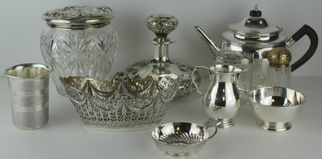 SILVER. Assorted American & Continental Silver.: Includes English Tiffany & Co. sterling creamer and sugar; a Hanau German Wolf & Knell .800 silver openwork basket; a German .812 silver beaker; an English gilt silver mounted vanity jar - Lon