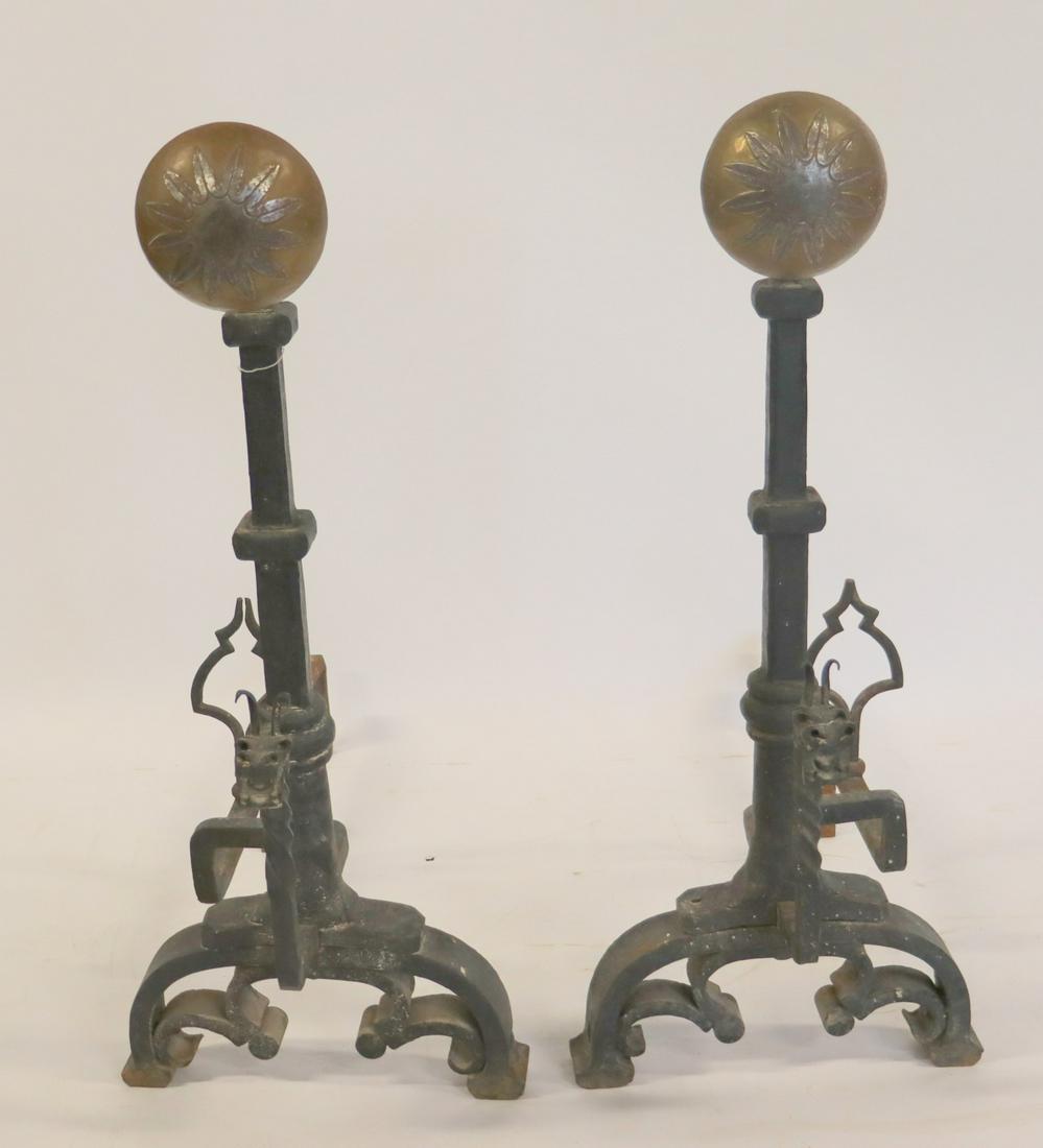 A Very Large Pair Of Hand Wrought Iron Andirons.: Decorated with Griffins and brass Sunflower finial. From a Westport CT estate. - Dimensions: 39"H