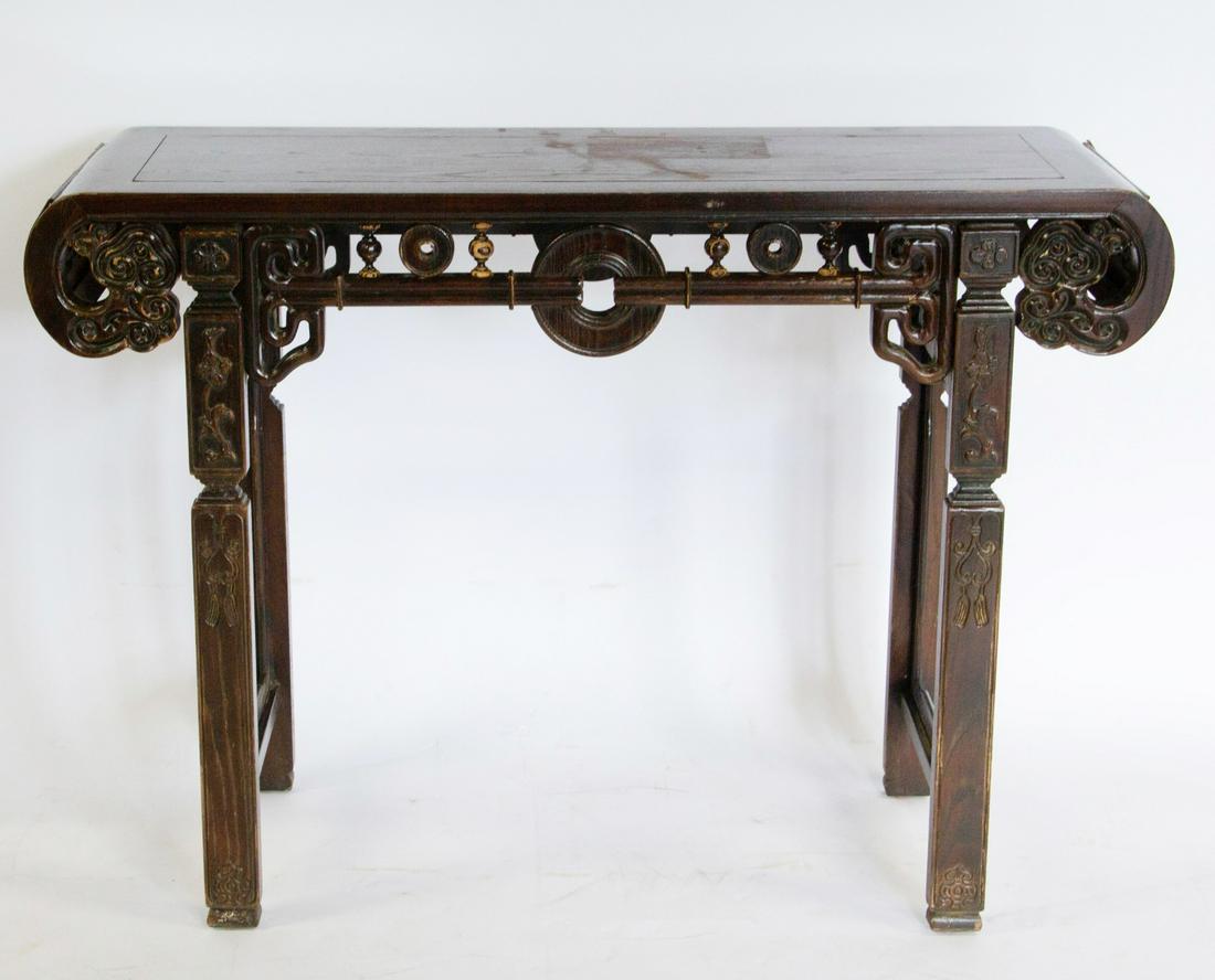 Chinese Republic Style Altar Table.: Modern. A single panel top terminating in scrolled ends with ruyi decoration and with pierced geometric panels to sides within beaded borders. The front apron with coin motif, the legs carved with tas
