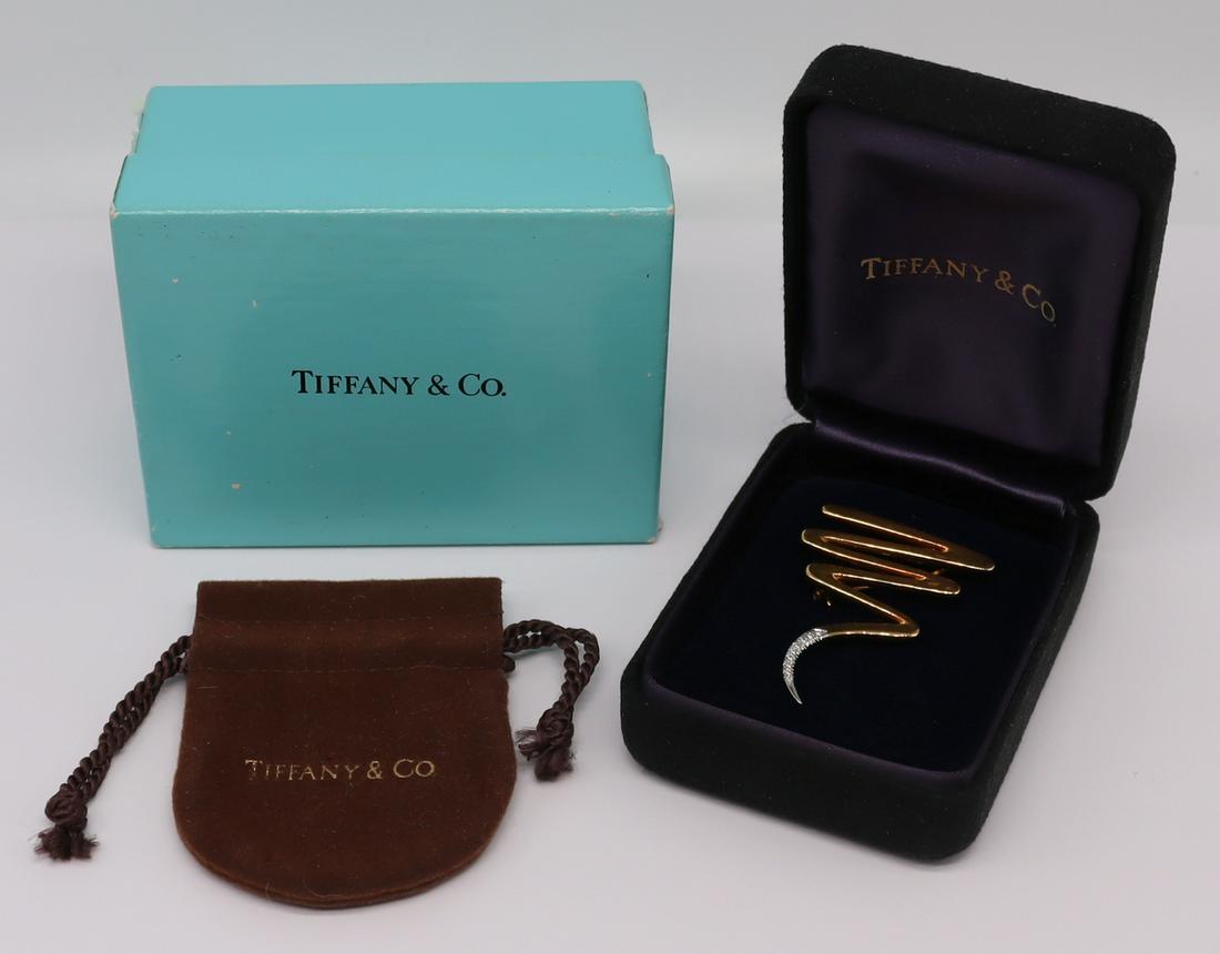 JEWELRY. Paloma Picasso for Tiffany 18kt Gold and: Platinum Brooch. Paloma Picasso for Tiffany & Co. 18kt yellow gold, platinum, and diamond scribble or zigzag brooch. Stamped verso, "Paloma Picasso 1983 Tiffany & Co 750 PT950". acco