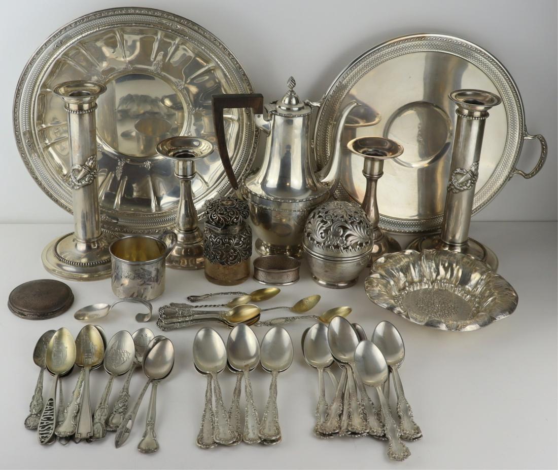 STERLING. Assorted Sterling Hollow Ware & Flatware: Includes a pair of Mauser Manufacturing Co. sterling candlesticks with applied design, no. 5635; Bigelow Kennard & Co. sterling teapot; a monogrammed Gorham sterling vanity jar; a monogrammed Theo