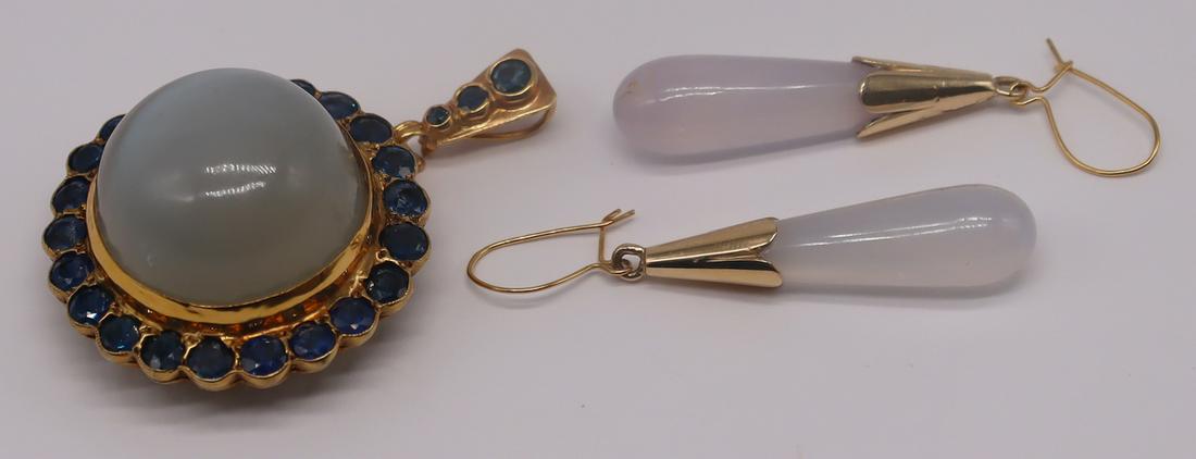 JEWELRY. Moonstone and Sapphire Pendant.: Includes a gilt silver mounted pendant comprised of a central cat's eye? moonstone cabochon, a surround of (22) round cut sapphires, and a later added 14kt yellow gold bail inlaid with (3) sapphires g
