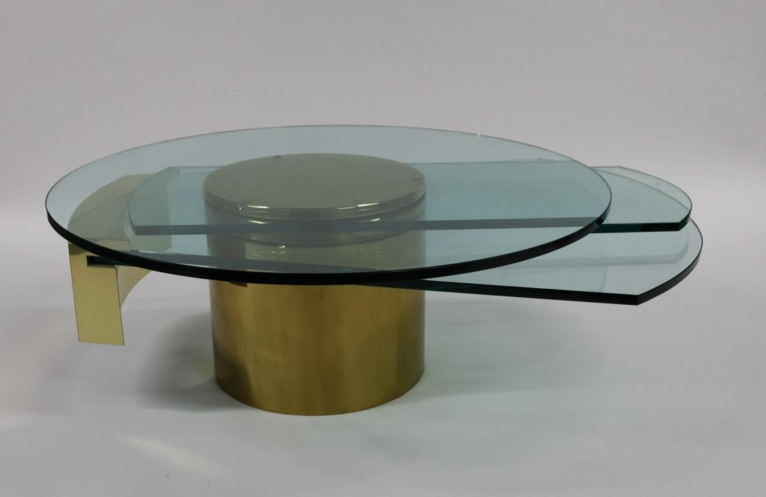 Dakota Jackson Self Winding Coffee Table.: Coffee table has three moving glass components. Reference: www.dakotajackson.com. From a Rye Brook estate. - Dimensions: 44-60"dia range x 17" h