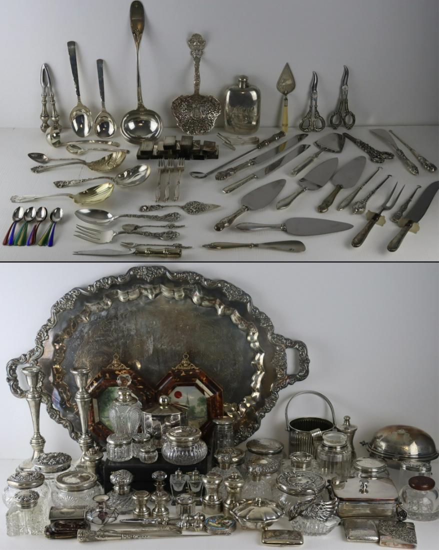 SILVER. Large Lot of Silver and Silverplate Items.: Includes a pair of Cartier weighted sterling candlesticks; a large Poole Silver Co. "Lancaster Rose" silverplate serving tray; (2) boxed sets of (12) Sheffield silverplate knives; a Selene M