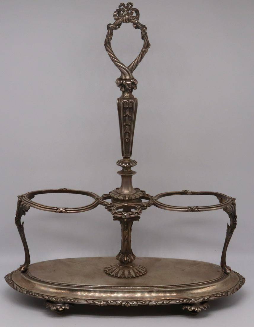 SILVER. Christofle French .950 Silver Cruet Stand.: Christofle French .950 silver footed cruet stand with central handle with ribbon motif. Stamped to underside, "Christofle 371654", with French 1st standard domestic hallmark representing .95