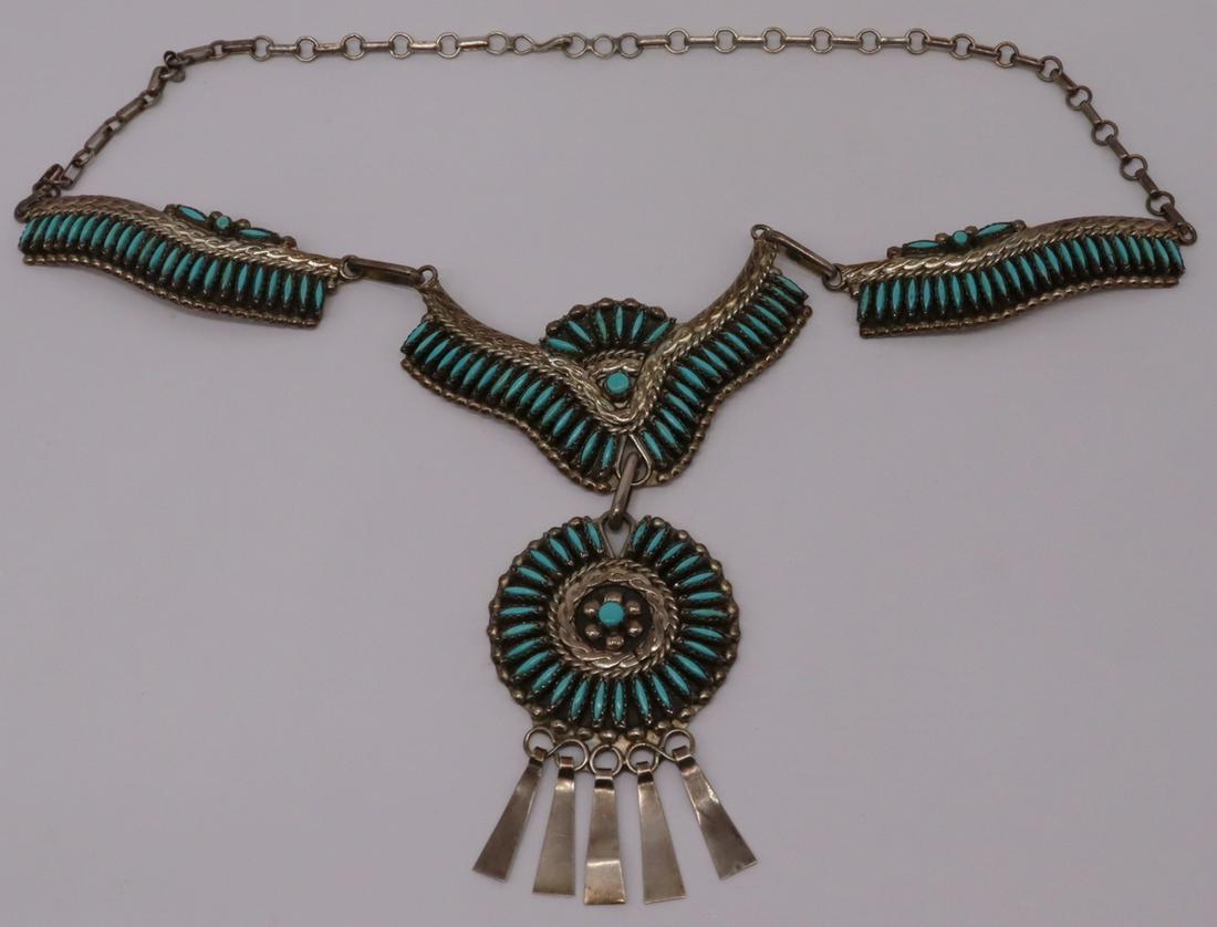 STERLING. Signed Sterling and Turquoise Squash: Blossom Necklace. Signed sterling and needlepoint turquoise squash blossom necklace. Signed, "Sterling HH", HH most probably representing Herbert Harvey. Total approx. weight is 2.05 troy oz