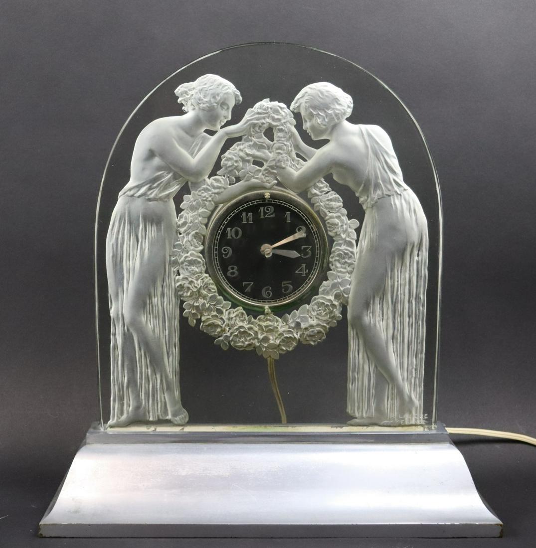 René Lalique Signed "Deux Figurine" Bedside Clock: Molded frosted glass and nickeled-bronze, model introduced 1926. Marcilhac #726. Inscribed R.LALIQUE. From an important NYC collection. - Dimensions: 15 in. (38.1 cm.) high