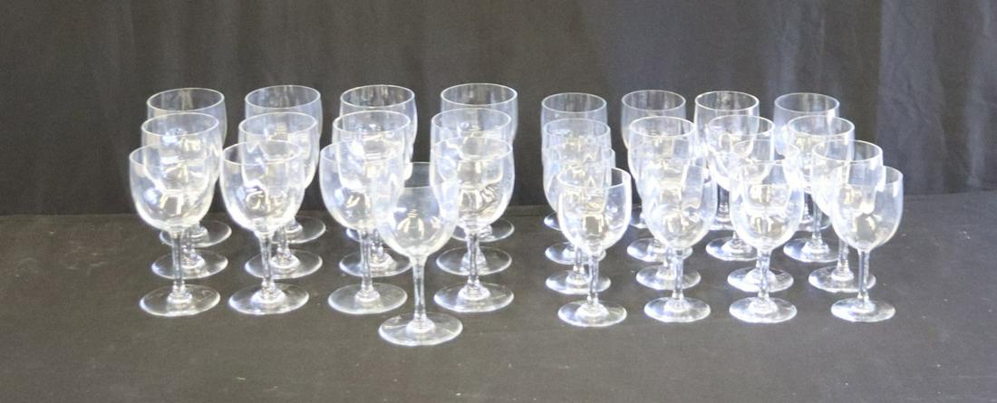Lot Of Baccarat Montaigne Stemware: To include 12 Red Wine Glasses (3.25" dia x 6.5") and 16 White Wine Glasses (2.75" dia x 6" h). Signed and from a Scarsdale estate.Please note: We found a chip on the red wine and removing one. There 