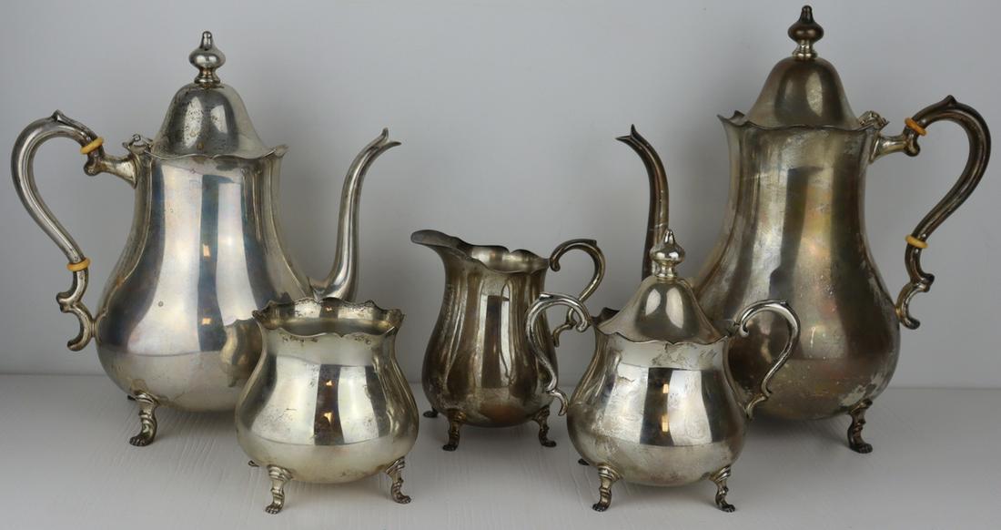STELING. 5 Pc. Fina Sterling Tea Service.: Fina sterling tea service comprised of a teapot, coffee pot, creamer, lidded sugar, and waste vessel. All items stamped to underside, "Sterling By Fina 717". Total approx. weight of all item