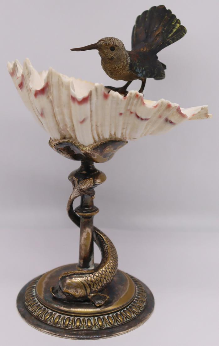 SILVERPLATE. Silverplate Tazza with Bronze Bird.: Wonderful silverplate tazza comprised of an applied dolphin suspended from base, shell form bowl, and an Austrian cold painted bronze hummingbird. Hummingbird is stamped to underside, "15". From a Pel