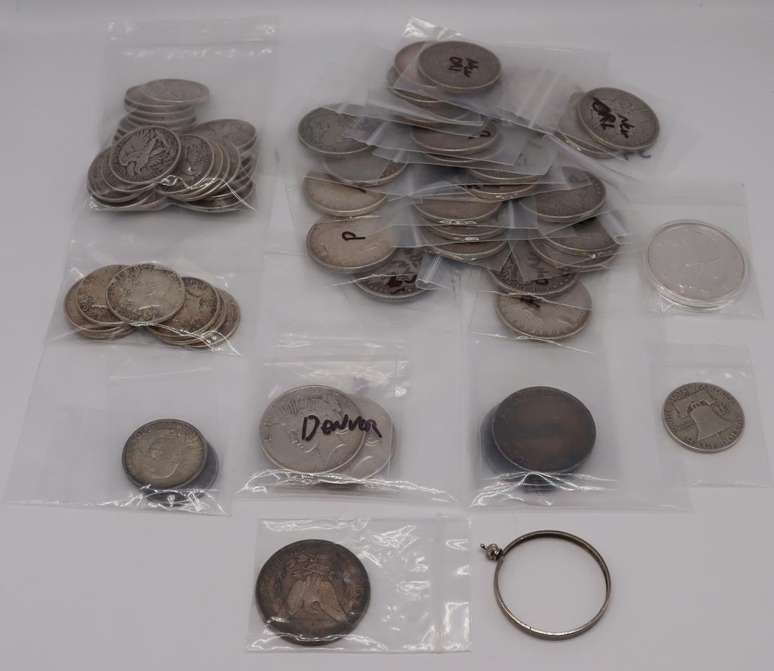 COINS. Assorted US Coin Collection.: Includes (1) 1889 silver dollar with pendant bezel; (2) 1922-1923 5 Swiss Francs, 90%, silver toned; (8) toned/circulated 90% 1964 JFK half dollars; Exonumia 1oz silver round private mint, not a silve