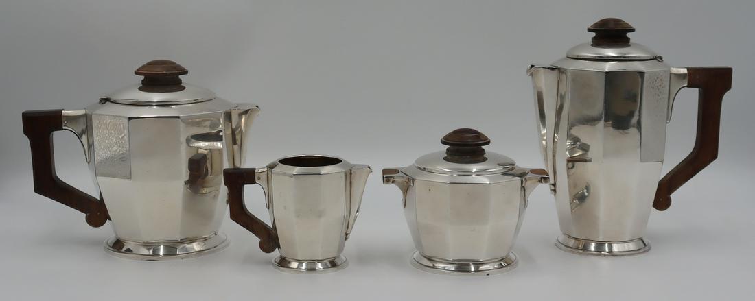SILVER. Signed 4 Pc. French .950 Silver Tea Set.: Signed French 4 piece .950 silver tea and coffee service comprised of a teapot, coffee pot, lidded sugar, and creamer. All items with wooden handles, and finials (when applicable). Stamped, "ML&q