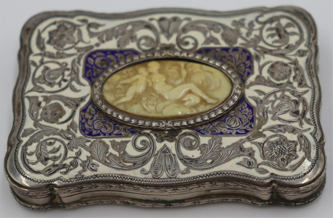 SILVER. Continental .800 Silver and Enamel Box.: Continental .800 silver hinged box with central carved depiction of a nude beauty and putti, with a blue and white enamel decorated surround. Stamped, "800" to interior of box. Gold wash to interior o