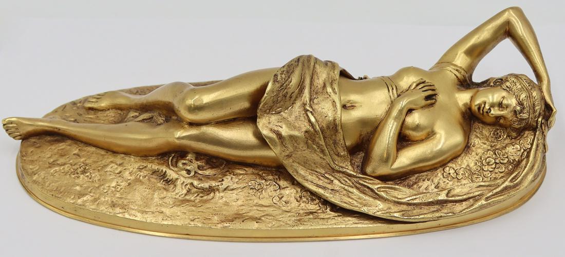 Gilt Bronze Erotic Reclining Nude.: Gilt bronze reclining female nude covered with draped fabric. Hinged draped fabric reveals female form. Apparently unmarked. From an E 66th St, Manhattan estate. Dimensions: bronze measures approx. 9&