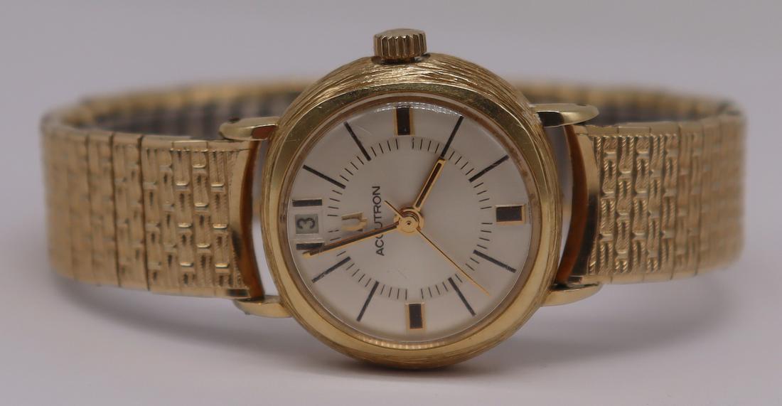 JEWELRY. Ladies Bulova Accutron 14kt Gold Watch.: Ladies Bulove Accutron 14kt yellow gold watch face with textured finish to goldwork. Stamped to underside of watch face, "Bulova N3 H79739 14kt Gold Case". On a Speidel band. From a Mt Verno