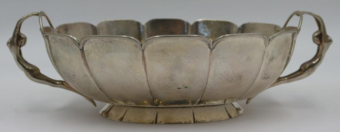 SILVER. Continental .800 Silver Handhammered Bowl.: Continental .800 silver handhammered pedestal bowl with scalloped edge and nude female handles. Stamped to underside, "800" with an unidentified column form pictorial hallmark. Total approx.