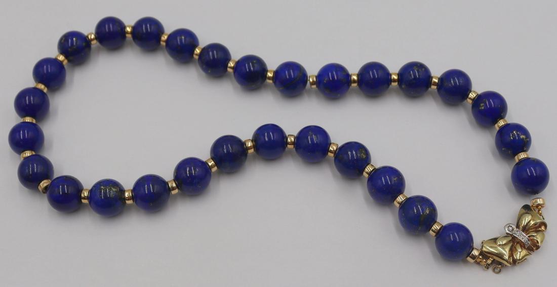 JEWELRY. 14kt Gold, Lapis Lazulis, and Diamond: Necklace. Includes a single strand of carved Lapis Lazulis beads separated by gilt rondelles. With a 14kt yellow gold butterfly form clasp with diamond accents. Stamped, "14K 585". Total app
