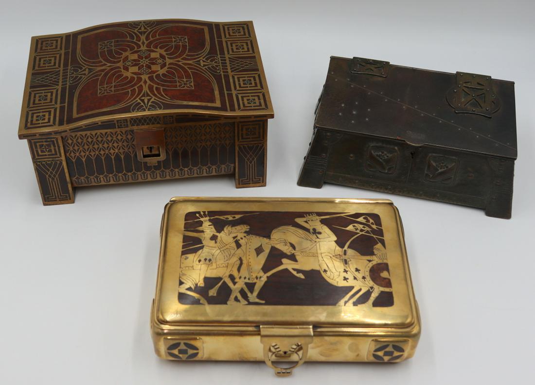 (3) Continental Decorative Boxes.: Includes a signed brass box with wooden inlay and depiction of men battling on horseback with shields - pictorial hallmark to underside, some losses to wood; an Argentinean Isabellas Artes Arts and Cr