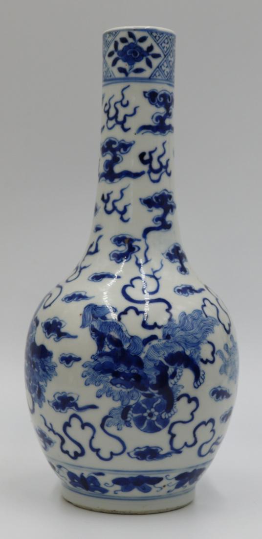 Possibly 19th C Chinese Blue and White Vase.: Decorated with foo dogs. Underglaze mark. From an E 66th St, Manhattan estate. Dimensions: vase measures approx. 9.75" h.