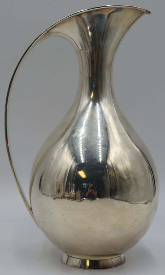 STERLING. Kay Fisker for A. Michelsen Sterling: Pitcher. Stamped to underside, "G9 ® C Sterling Denmark Kay Fisker A. Michelsen Copenhagen 1 5 L". Total approx. weight is 25.14 troy oz (gross). From a Larchmont, NY estate. Dimensions: