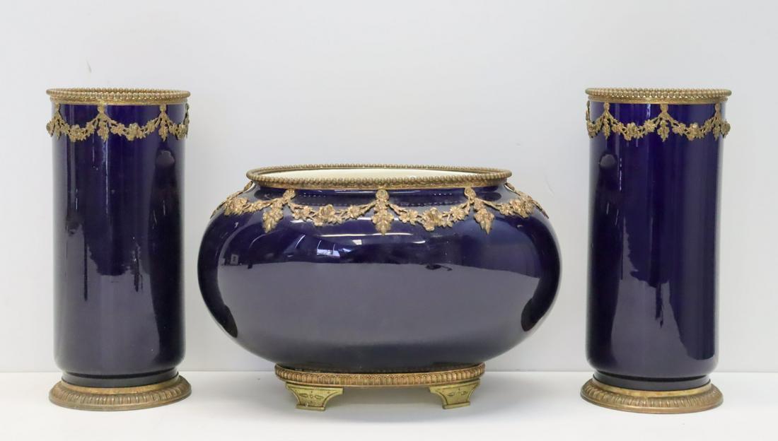 French Bronze Mounted Cobalt Porcelain: Garniture Set. From an Upper East Side NYC estate. - Dimensions: Vase 9.5" Center 17" x 7"