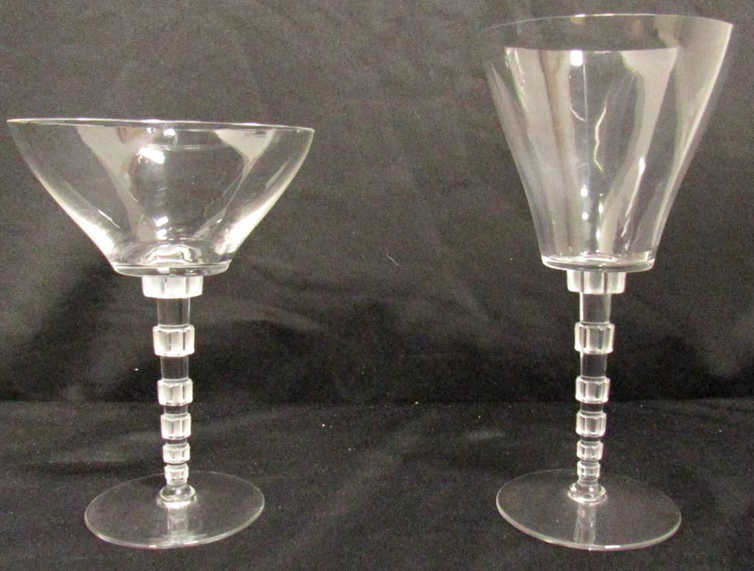 Lalique Signed Wine Goblets and Champagne: Saucer/Coupe’s. Includes (9) wine goblets (7 1/4" in height) and (8) champagne saucer/coupe's (6" in height" with frosted octagon stems. From a Scarsdale, NY estate.
