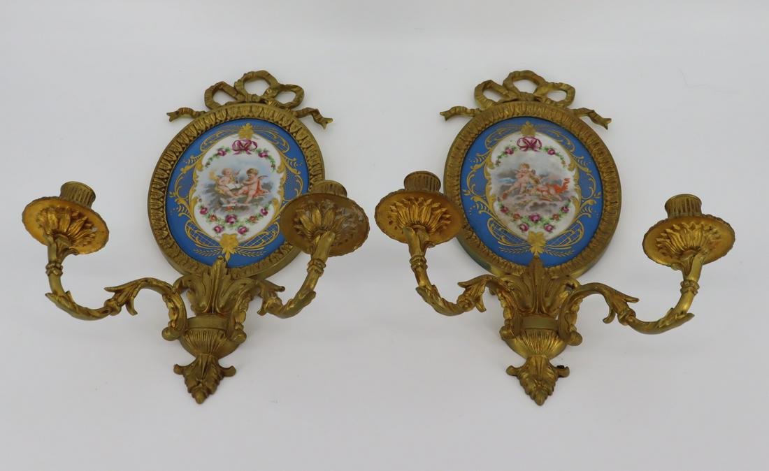 Pair of Gilt Bronze & Sevres & Porcelain Sconces: Fine quality with nice original patina, ribbon crown, and signed on the porcelain. From a Tuckahoe, NY estate. Dimensions: 14" x 10.5" Condition: Good.