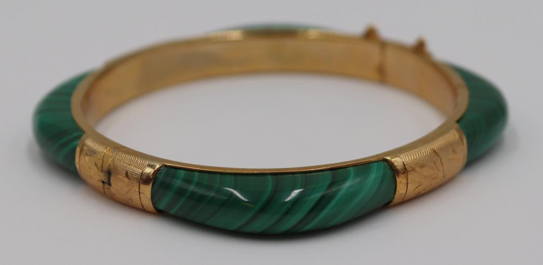 JEWELRY. Gilt Malachite Hinged Bracelet.: Gilt mounted hinged bracelet comprised of (4) panels of polished malachite. Apparently unmarked. From a Pelham Manor, NY estate. Dimensions: interior diameter of approx. 7".